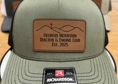 Olive and black Richardson trucker hat with leather patch by 400 Ink