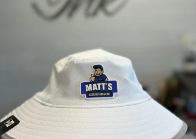 White bucket hat with full-color PVC patch by 400 Ink