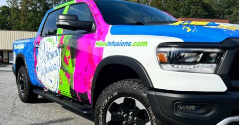 Ram truck with a full color Mike's Infusions vehicle wrap by 400 Ink in Dawsonville GA