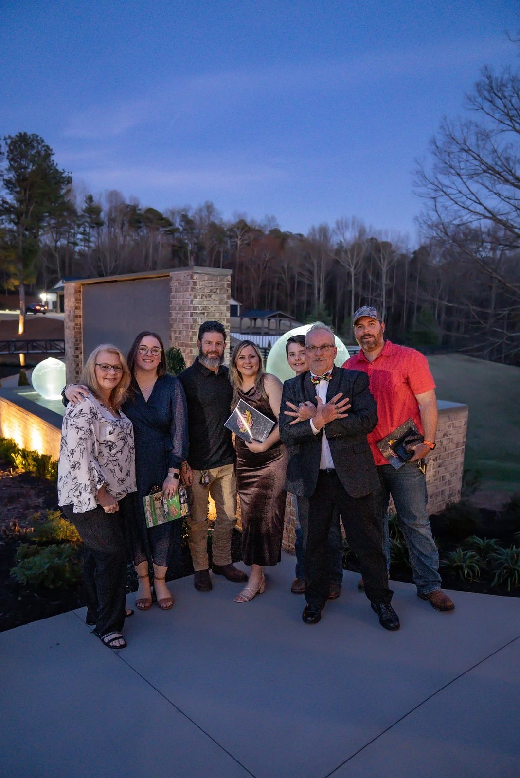 The 400 Ink team together outside at dusk in Dawsonville GA