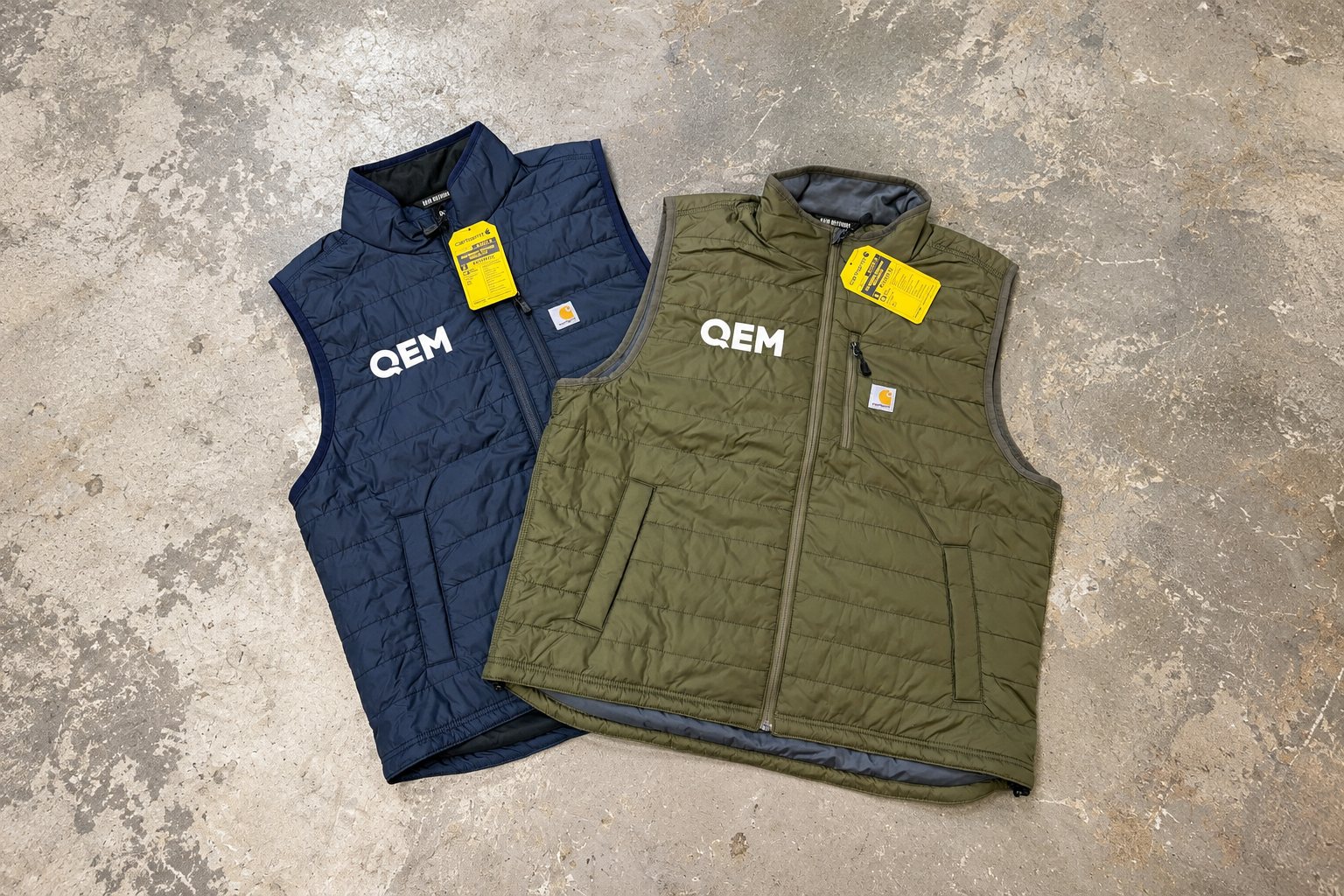 Navy and olive Carhartt vests embroidered with the QEM logo by 400 Ink in Dawsonville GA